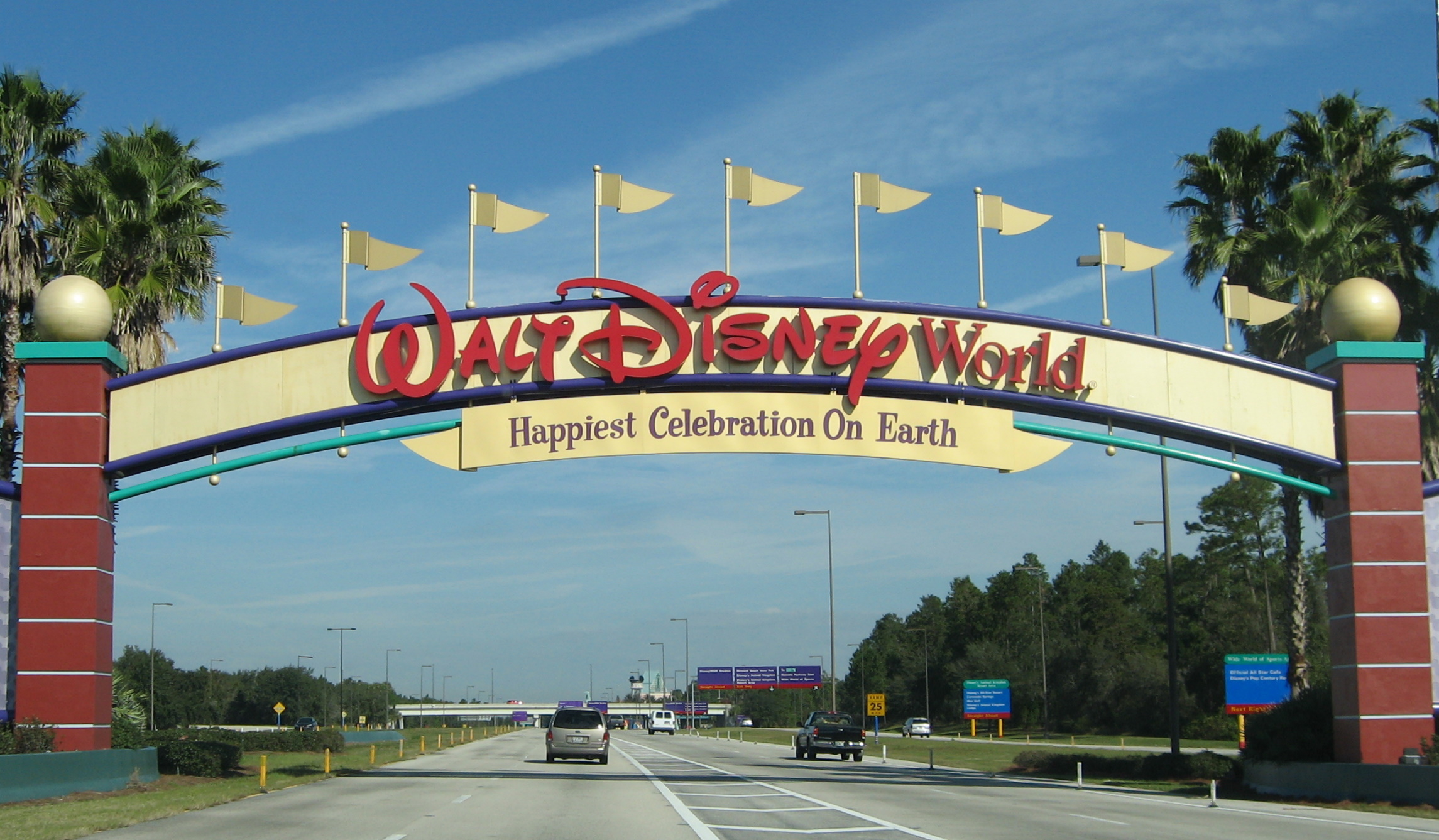 Disney_World_-_Entrance_sign_-_by_inkiboo